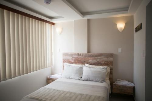 Ένα ή περισσότερα κρεβάτια σε δωμάτιο στο 212 Hotel