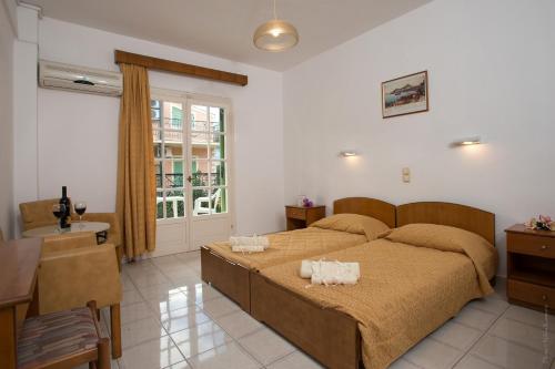 Postel nebo postele na pokoji v ubytování Philippos Hotel
