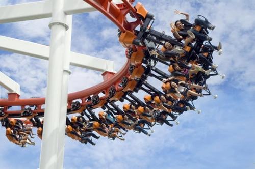 a group of people riding on a roller coaster at Natcha Place Rangsit Donmuang in Ban Talat Rangsit