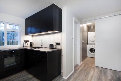 Kuchyň nebo kuchyňský kout v ubytování Nordurey Apartments