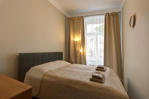 Postel nebo postele na pokoji v ubytování Karlovy Vary Zamecky Vrch