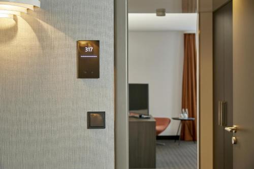 a door in a hotel room with the number at H4 Hotel Residenzschloss Bayreuth in Bayreuth
