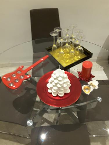 a table with a red plate with a cake on it at Big Johnny B in Rome