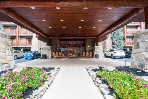a large building with flowers in front of it at Bearskin Lodge on the River in Gatlinburg