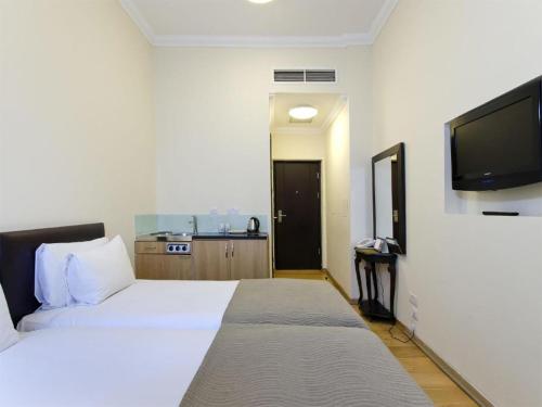 Katil atau katil-katil dalam bilik di The Royale Chulan Hyde Park Hotel