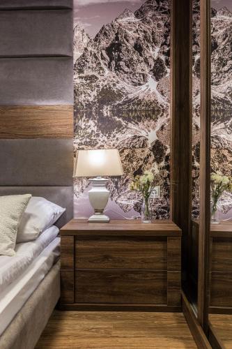 Postel nebo postele na pokoji v ubytování Aparthotel Góralski Spa & Restaurant