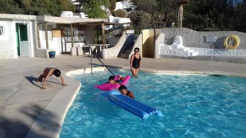 a group of people in a swimming pool at Al Jatib in Baza