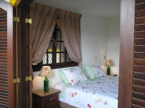 Katil atau katil-katil dalam bilik di Suites em meio a Mata Atlântica