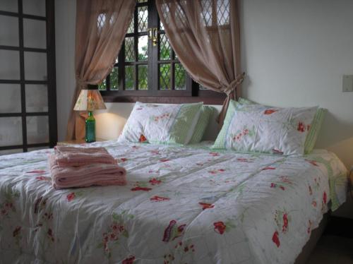 Katil atau katil-katil dalam bilik di Suites em meio a Mata Atlântica