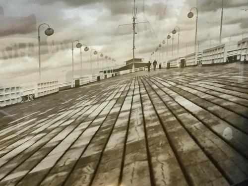 a wooden boardwalk with lights on top of it at Sopocka Bryza in Sopot