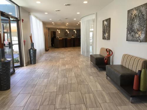 a lobby with couches and a waiting room at Plaza Hotel Denver Central in Denver