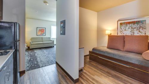 a living room with a couch and a television at Holiday Inn & Suites Bellingham by IHG in Bellingham