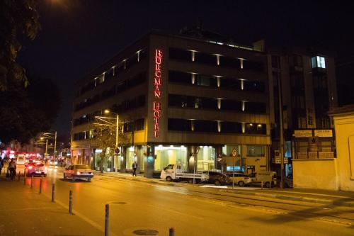 a building on a city street at night at Burcman Hotel in Bursa