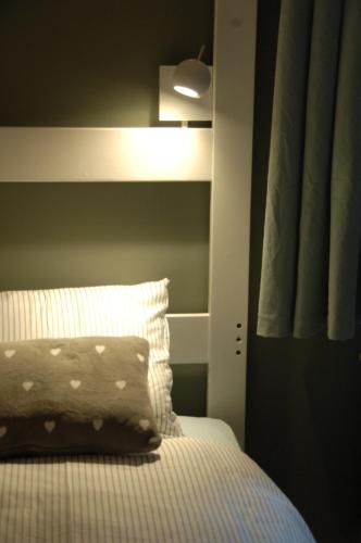 Una cama o camas en una habitación de Gite La Petite Beurrerie des Ardennes