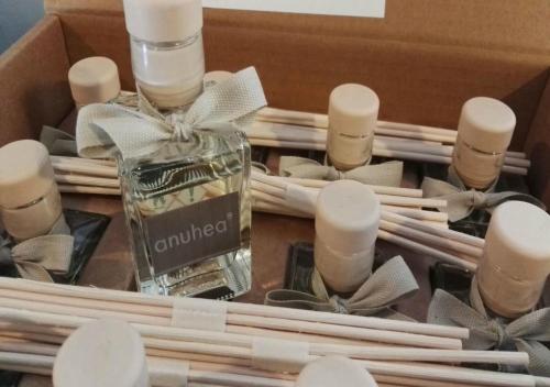 a box of candles and a bottle of perfume at Hotel Storyville - svago e convenzioni aziendali in Cinquale