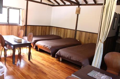 Postel nebo postele na pokoji v ubytování Nangoku Lodge Booya