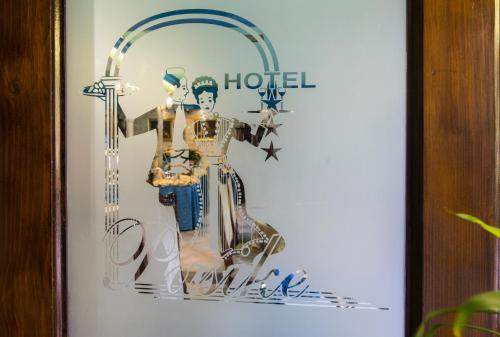 a picture of two mannequins on a wall at Heritage Hotel Pasike in Trogir