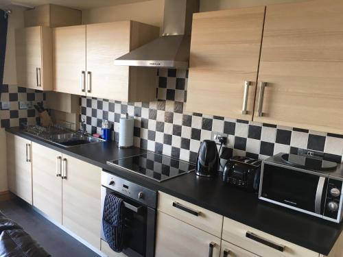 Η κουζίνα ή μικρή κουζίνα στο Crud yr Awel Apartment
