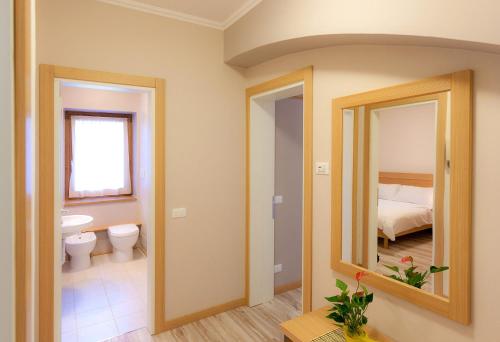 Postel nebo postele na pokoji v ubytování Appartamenti Regina