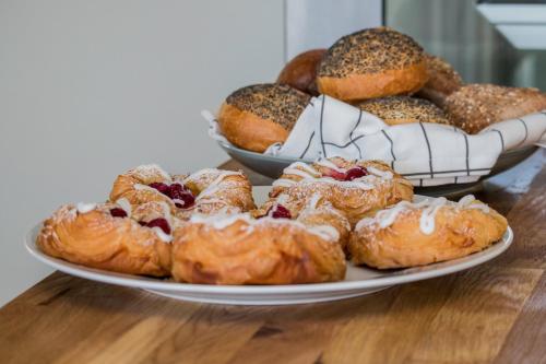 a plate of pastries on top of a table at Stall Hällarp in Falkenberg