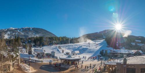 a ski resort with a ski slope in the snow at Sundial Hotel in Whistler