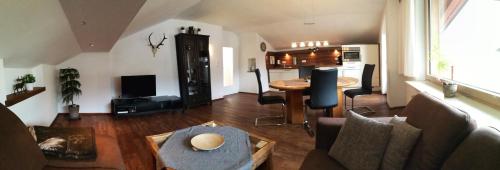 a living room with a couch and a table at Ferienwohnung Traudl in Inzell