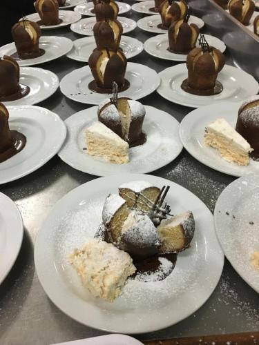 a bunch of desserts on plates on a table at Atlantis Palace Hotel in Mascali