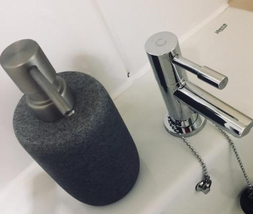 a close up of a toilet in a bathroom at Sky Night Serviced Apartments in Cardiff