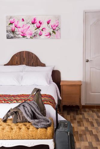 Una cama o camas en una habitación de El Encanto
