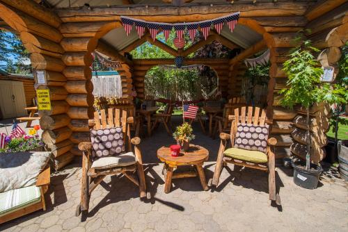 a wooden cabin with two chairs and a table in it at Fireside Lodge in South Lake Tahoe