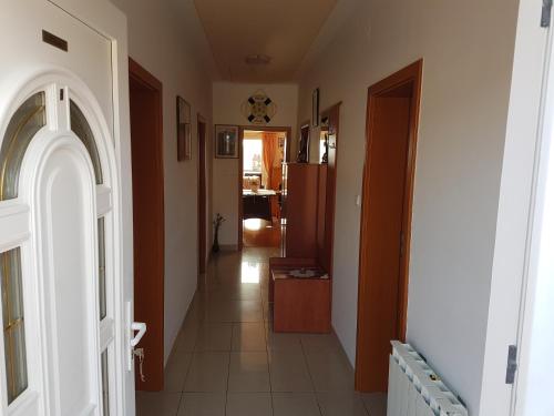 a hallway of a home with an archway and a hallway at Apartments Stengl in Rab
