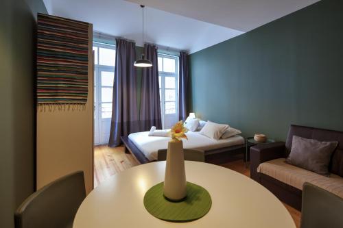 Ένα ή περισσότερα κρεβάτια σε δωμάτιο στο Aparthotel Oporto Entreparedes