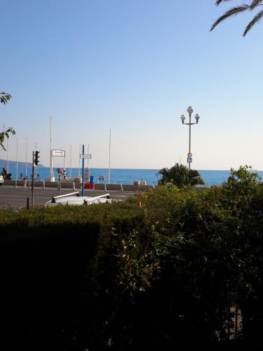 a parking lot with the ocean in the background at Nice Promenade Apartment in Nice