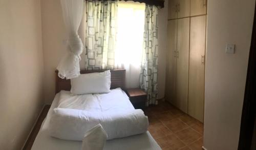 Ein Bett oder Betten in einem Zimmer der Unterkunft Easy Sleep Guesthouse