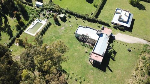 an aerial view of a house in a field at Quinta El Monte in Tandil