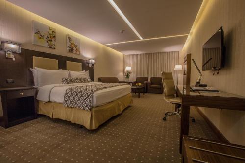 Ένα ή περισσότερα κρεβάτια σε δωμάτιο στο Olive Tree Amman