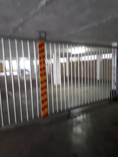 a white and orange railing in a parking garage at Boulevard 501 in Margate