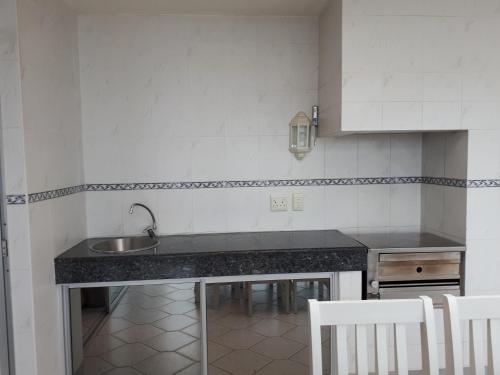 a kitchen with a sink and a counter top at Boulevard 501 in Margate