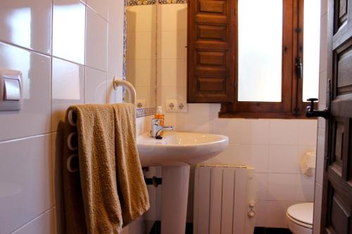 a bathroom with a sink and a toilet at Casas Rurales el Palomar in Ossa de Montiel