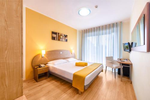 Ένα ή περισσότερα κρεβάτια σε δωμάτιο στο Hotel San Marco