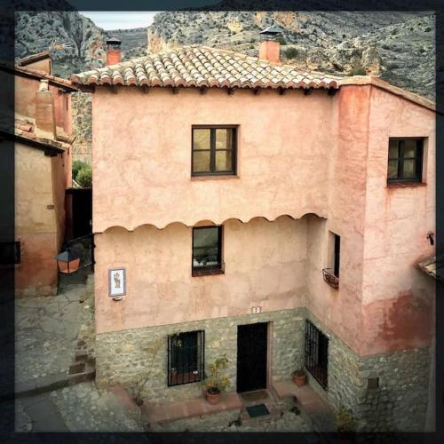 an aerial view of a large building with windows at Apartamento Portal del Agua in Albarracín
