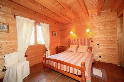 En eller flere senge i et værelse på L'ARBA-CLAR