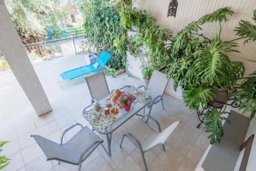 an overhead view of a patio with a table and chairs at Kiki's Apartments in Barbati