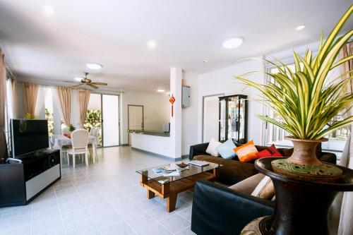 a living room with a couch and a table at Bann Mountain View in Ao Nang Beach