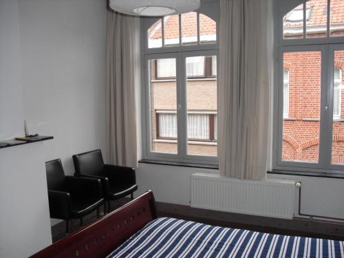 TV a/nebo společenská místnost v ubytování Guesthouse Oude Houtmarkt