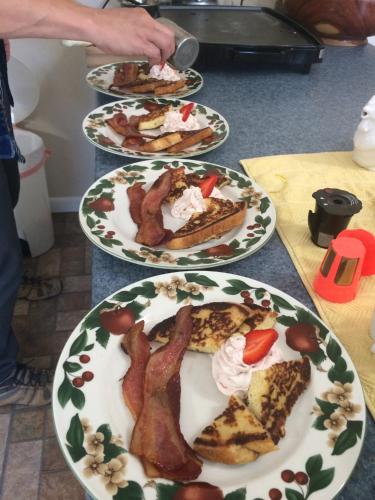 a group of plates of food on a table at Grafton Lodge in Lake Lure
