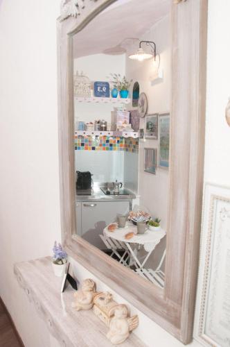a mirror sitting on a table in a kitchen at La Camera Dal Ponte in Dolceacqua