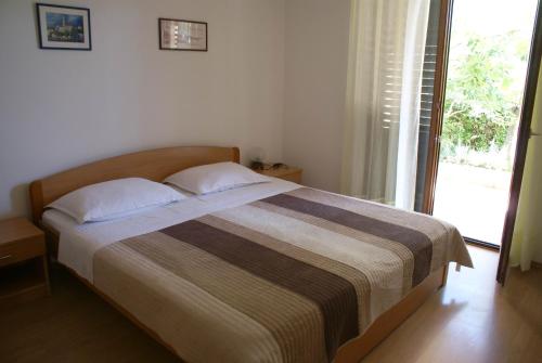 Posteľ alebo postele v izbe v ubytovaní Apartment Ana M
