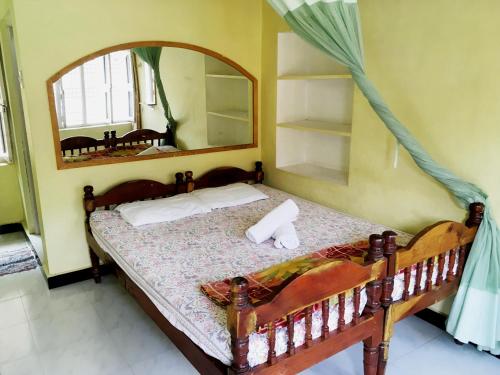 En eller flere senger på et rom på Kalyan Guesthouse