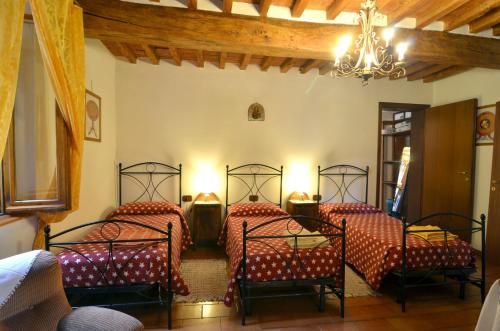 Posteľ alebo postele v izbe v ubytovaní BeB Reboglio